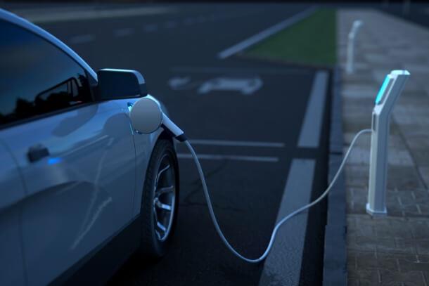 Electric car being charged, symbolizing Teflon™’s contribution to energy-efficient battery and EV technology