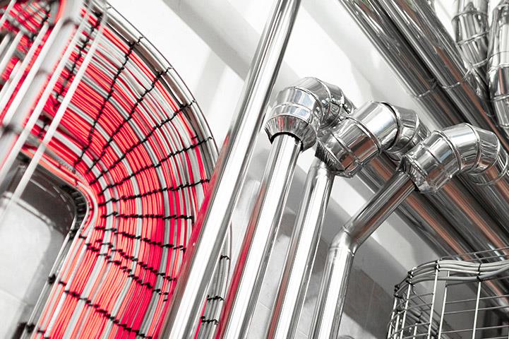 industrial equipment and pipelines in a cheese production factory
