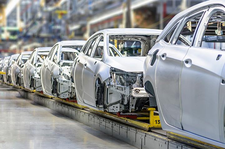 white cars on factory production assembly line